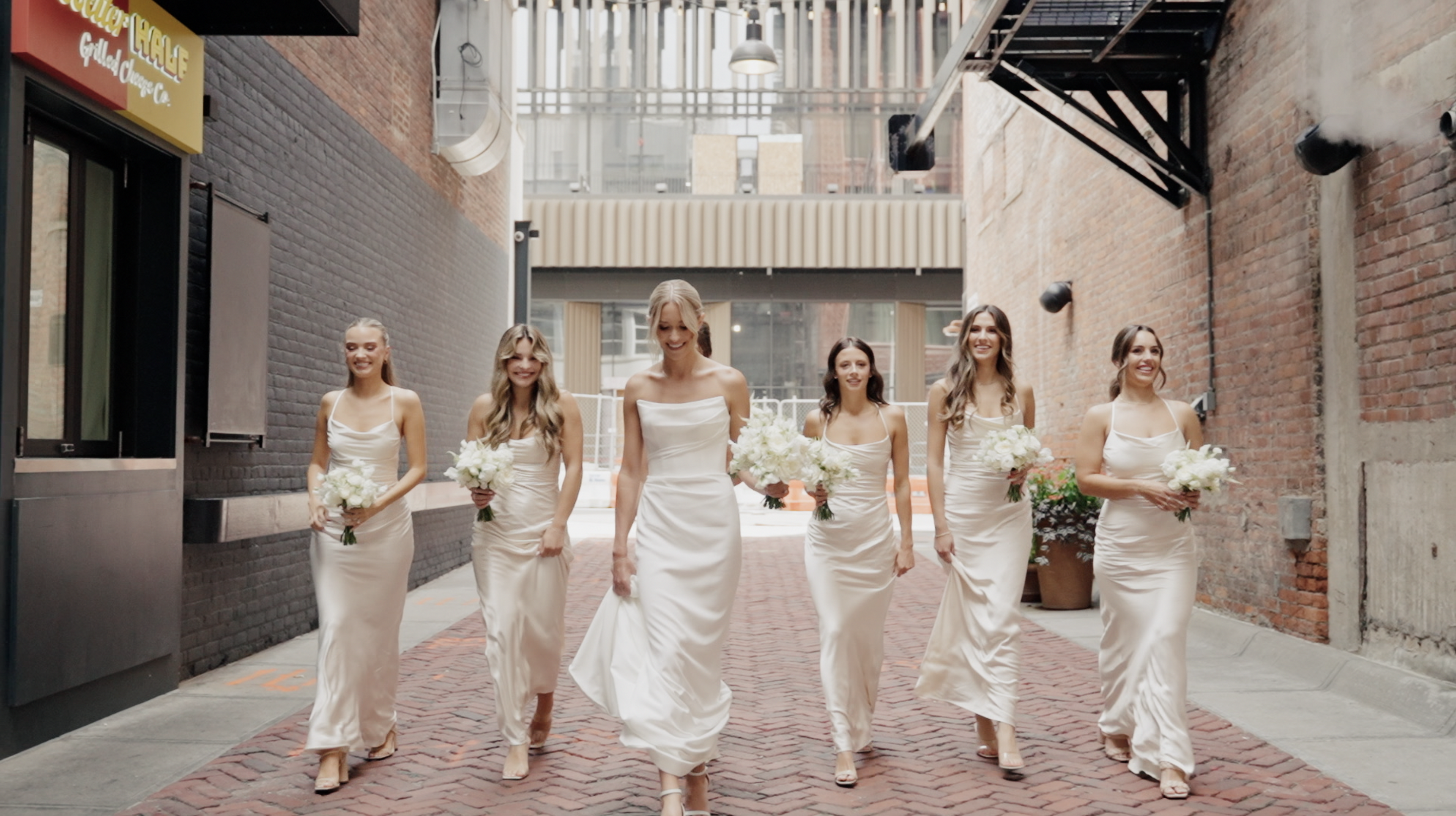 bridesmaids walking through downtown detroit